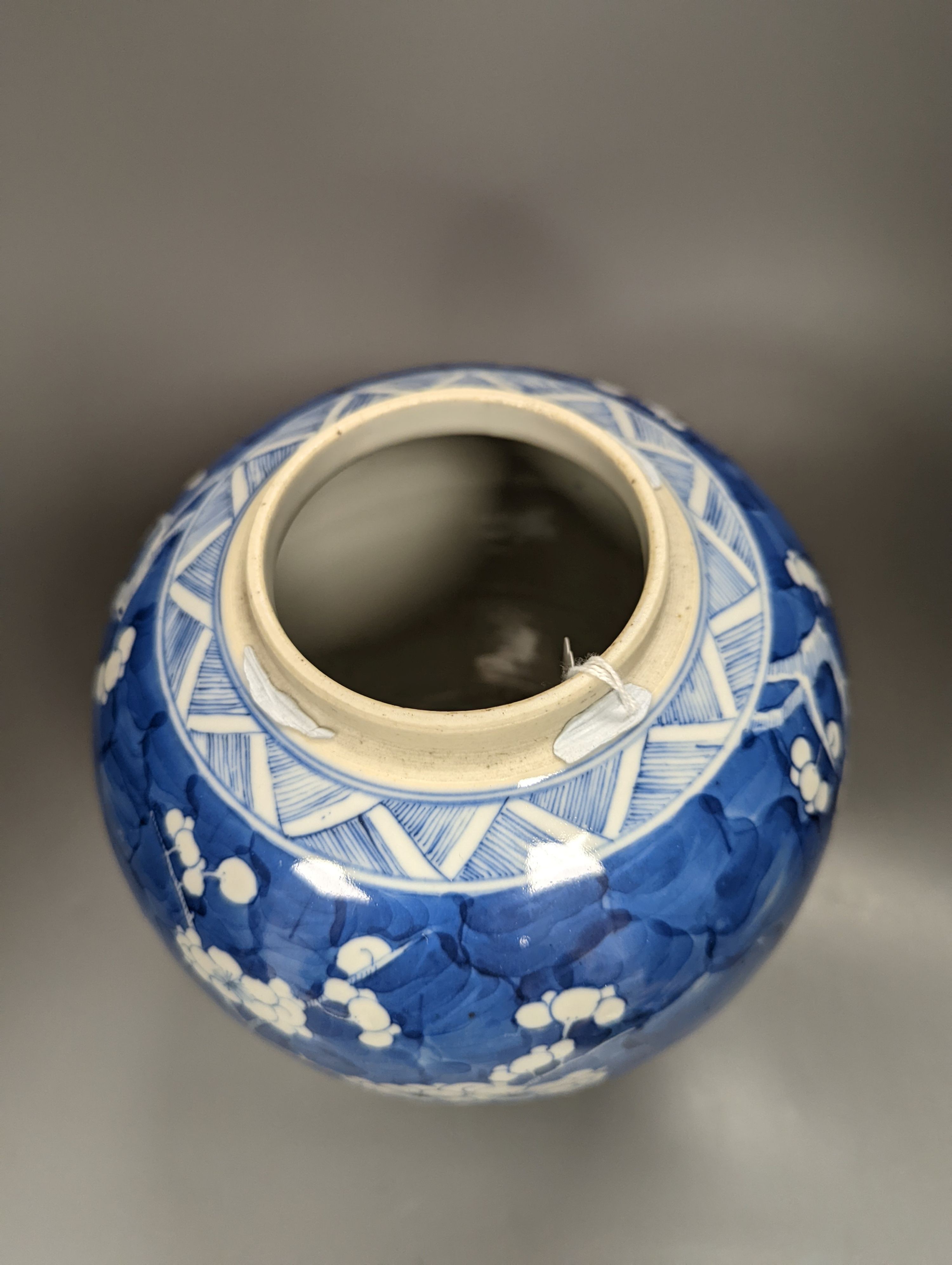 A 19th century Chinese prunus blossom ginger jar and cover, on stand, height 25cm